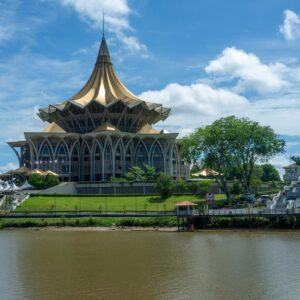 a large building sitting on top of a lush green field